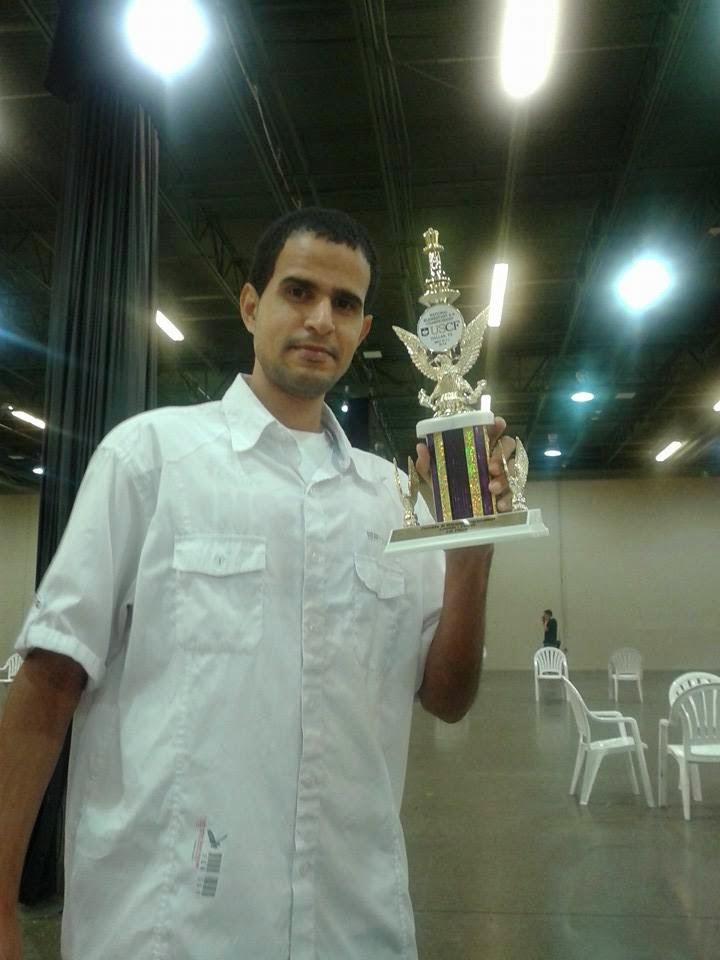 Holding a USCF tournament trophy