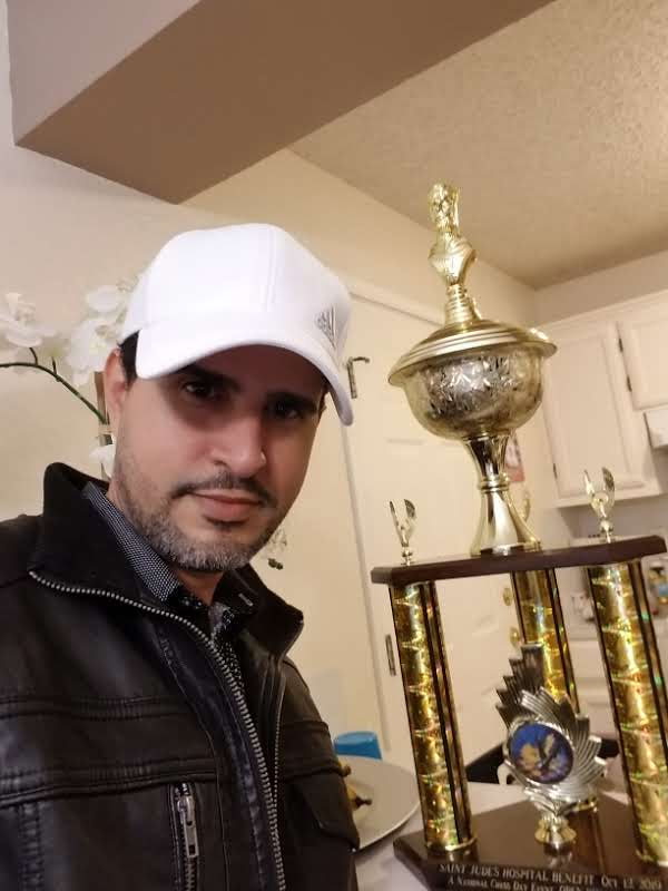 With a trophy at home